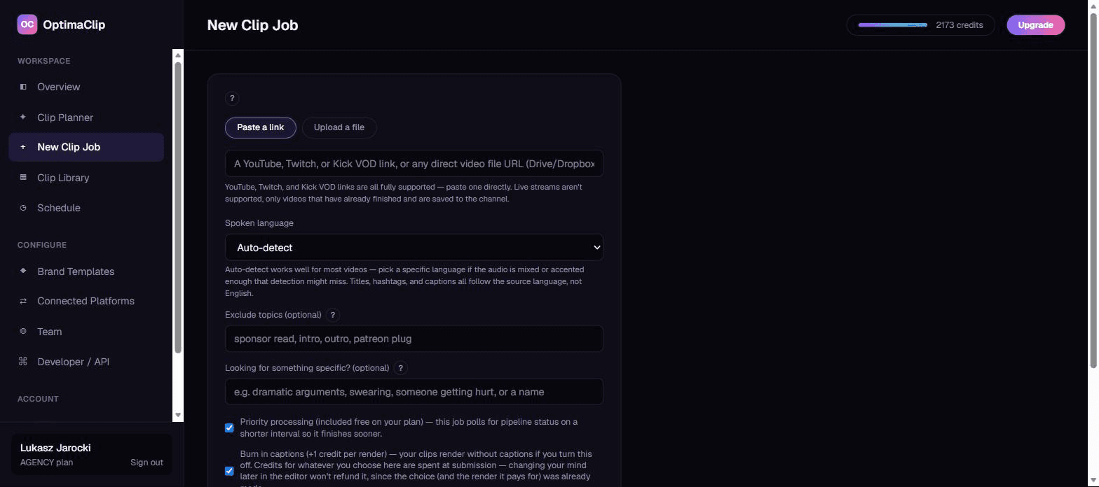 Real OptimaClip New Clip Job screen showing YouTube, Twitch, and Kick VOD import all supported, plus the AI moment-search field for finding specific moments like dramatic arguments or a name